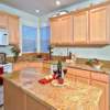 Kitchen Remodel Everett, WA: New 3cm Granite Counter Tops with new Stainless Steel Undermounted Sink and Custom Travertine Back Splash