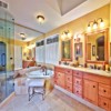 Bathroom Remodel in Mill Creek, WA: Bathroom Floor - Heated Limestone Tile Floor, Granite Counter Top with Undermounted Sinks and Custom Natural Stone Back Splash