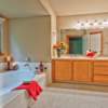 House Repair Edmonds, WA: AFTER Complete Bathroom Remodel. All new Porcelain Tile Flooring, new plumbing fixtures, New Custome Shower glass Enclosure. All new light fixtures. New paint job. New trim work. Re-laminated Counter Tops