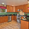 Home Addition Lynnwood, WA: Featuring - Kitchen with Custom Tile Flooring (12x12 porcelain), Tile Wall Base, Granite Kitchen Counter Tops (2cm Black Galaxy granite with full bull nose), Under-mounted stainless steel 33x22 sink. Maple wall and base cabinets