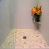 Bathroom Remodel Seattle. AFTER: Shower Flooring - (Natural Stone) Island Pebbles 'KUTA WHITE', Shower Walls - 12x24 Porcelain 'PARK AVENUE, AVORIO', Shower Enclosure - Custom Floor to Ceiling 3/8 thick Frameless Clear Glass Set