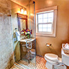 Everett 1901 Home Guest Bath;This space was previously a closet. Plumbing required supply and waste lines had to be run across the house without disturbing the finished space below.