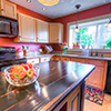 Everett 1901 Home Kitchen;isFormica Countertops are replaced with Quartz, the limestone backsplash compliments the new sink and faucet.