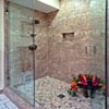 Bathroom Remodel Everett, WA: Custom 3'x5' full shower. 1x1 mosaic porcelain/glass mixed floor, and 8x16 porcelain wall tile. Custom in-shower recessed lighting. Stainless steel Delta mixer valve and water diverter. Dual shower/rain head. Custom shower enclosure - 3/8 thick clear glass, frameless set, clear polycarbonate seals, and antimicrobial silicone