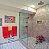 Bathroom Remodel Everett, WA: Custom 3'x5' full shower. 1x1 mosaic porcelain/glass mixed floor, and 8x16 porcelain wall tile. Custom in-shower recessed lighting. Stainless steel Delta mixer valve and water diverter. Dual shower/rain head. Custom shower enclosure - 3/8 thick clear glass, frameless set, clear polycarbonate seals, and antimicrobial silicone
