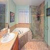 Bathroom Remodel, Bothell, WA: Removed old shower enclosure as well tub surround. Repaired/replaced all water-damaged framing members and sub-flooring. Installed new WEDI shower system, new tub enclosure and new counter tops. Shower Floor: Aspen Lodge (shadow pine) octagon. Shower Walls: Aspen Lodge (shadow pine) 12x12 porcelain tile. Custom 3/8 glass frameless shower glass enclosure and much more.